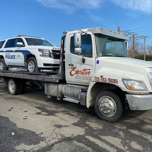 CARSTAR Collision Center Morganville tow truck