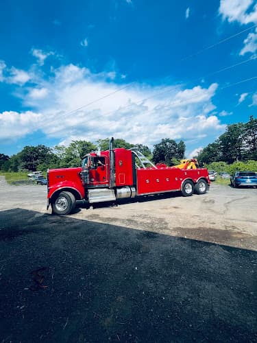 Peer's 24 Hr Towing And Used auto parts tow truck