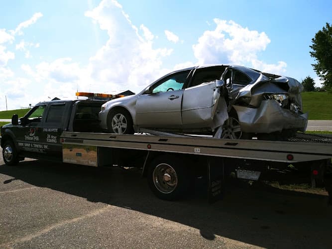 Pelican Pete Body Shop & Towing Inc. tow truck