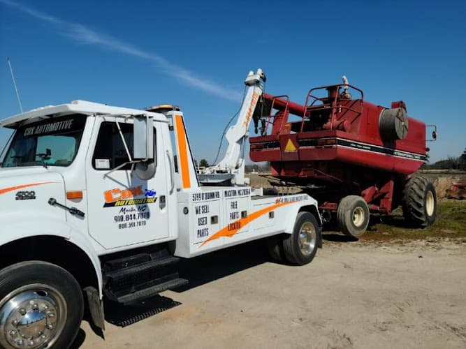 Cox Automotive and Wrecker Service tow truck
