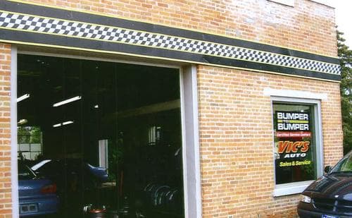 Vic's Auto Body tow truck